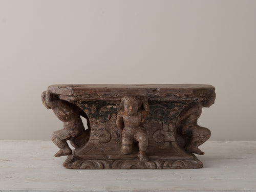 PEDESTAL WITH CARVED PUTTI